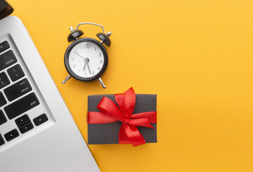 top-view-laptop-with-clock-and-gift.jpg